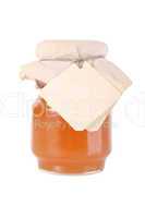 Golden honey jar with empty white tag