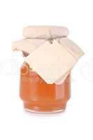 Golden honey jar with empty white tag
