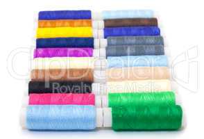 Several Multicolor Spools of Thread