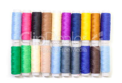 Several Multicolor Spools of Thread