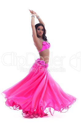 Young dancer in pink costume isolated