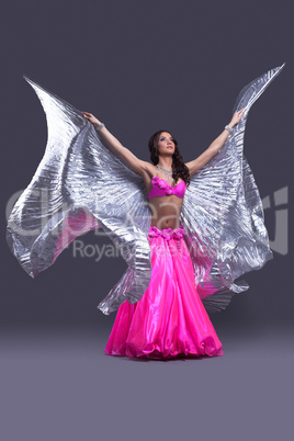 dancer performing oriental dance with wings