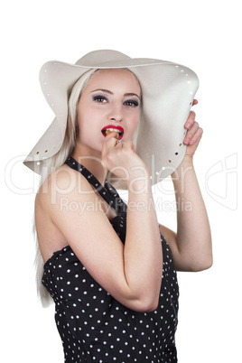 Attractive woman with hat and eating chocolate cookie