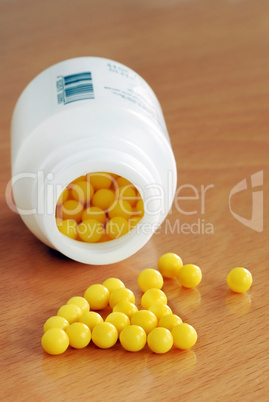 Yellow dragee pills