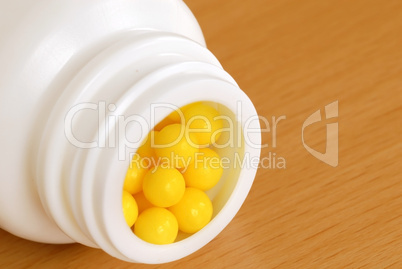 Yellow dragee pills