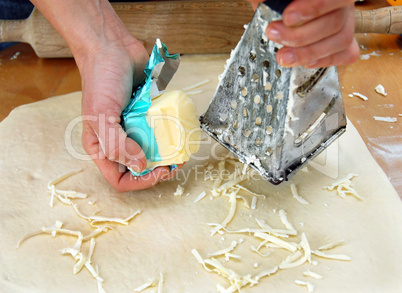 Grated butter on dough