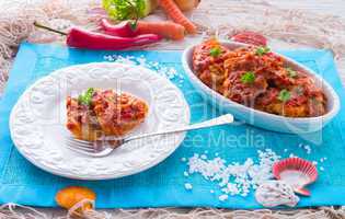 fish in Greek kind with vegetables and tomato sauce