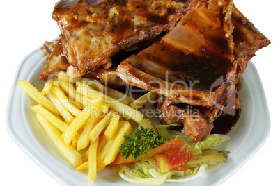 Spareribs and Fries on White Plate Close Up