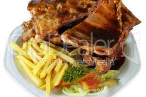 Spareribs and Fries on White Plate Close Up