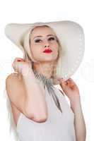 Beautiful young woman with diamond necklace and a hat, isolated