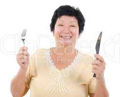 Senior Asian having meal