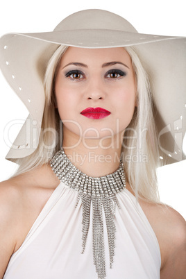 Beautiful young woman with diamond necklace and a hat