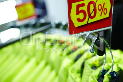 Sport and casual clothes on hangers in the shop.