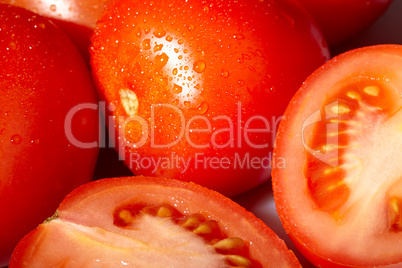 Fresh red tomatoes with water drops.