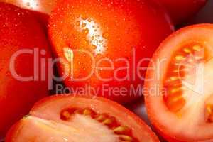 Fresh red tomatoes with water drops.