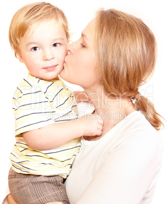 Young happy mother is kissing her child.