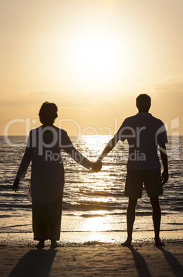 Senior Couple Holding Hands Sunset Tropical Beach