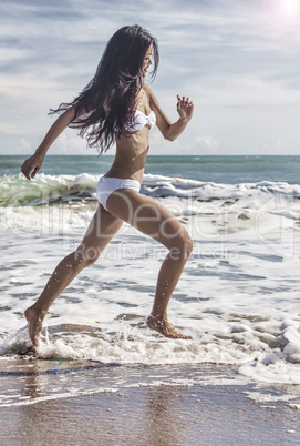 Sexy Woman Girl in Bikini Running on Beach