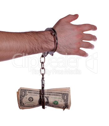 hand with handcuff and dollars