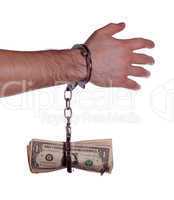 hand with handcuff and dollars