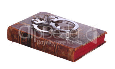 old book with handcuff