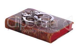 old book with handcuff