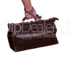 old leather bag with handcuff