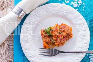 fish in Greek kind with vegetables and tomato sauce