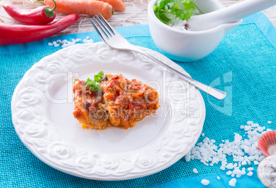 fish in Greek kind with vegetables and tomato sauce