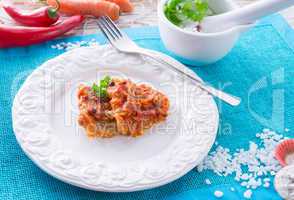 fish in Greek kind with vegetables and tomato sauce