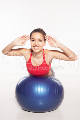 Smiling woman doing pilates