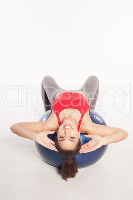 Beautiful woman doing pilates exercises