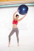 Woman exercising with a pilates ball