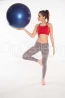 Woman using a pilates ball
