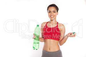 Smiling young woman with bottled water