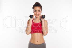 happy young woman working out with dumbbells