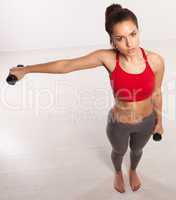 athletic woman working with dumbbells