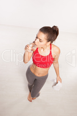 thirsty woman drinking a glass of water