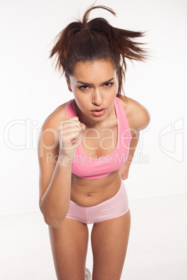 athletic woman running towards the camera