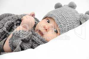 Baby in gray hat