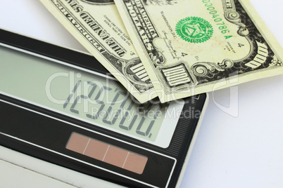 dollar banknotes and calculator