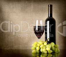 Dry red wine and grapes
