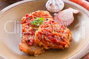 fish in Greek kind with vegetables and tomato sauce