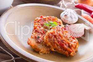 fish in Greek kind with vegetables and tomato sauce