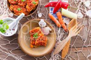 fish in Greek kind with vegetables and tomato sauce