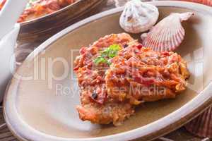 fish in Greek kind with vegetables and tomato sauce