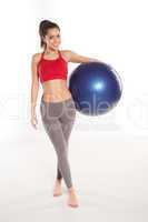 happy shapely girl with a pilates ball