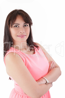 Portrait of a happy young business woman standing with folded ha