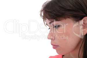 Depressed, sad woman on white background