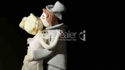 Wedding cake figurines kiss.